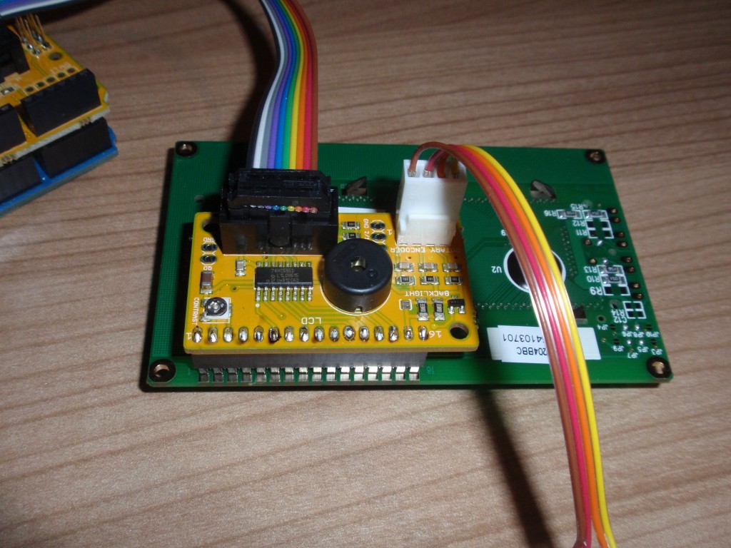 The LCD breakout board connects to the main board with a 10 pin IDC cable. The rotary encoder breakout board connects to the LCD board.On the LCD board is a small potmeter to adjust the brightness and a beeper for alarms.