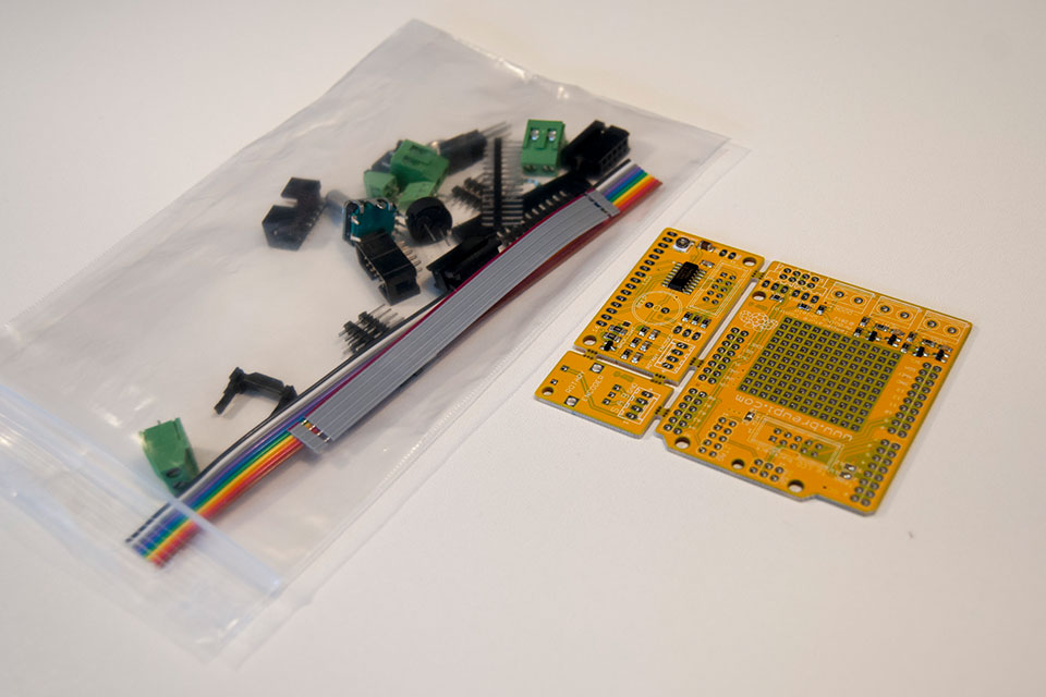 This is what you bought from the shop: a PCB with SMT components soldered and a bag of through hole parts. Go ahead and empty the bag on your desk.