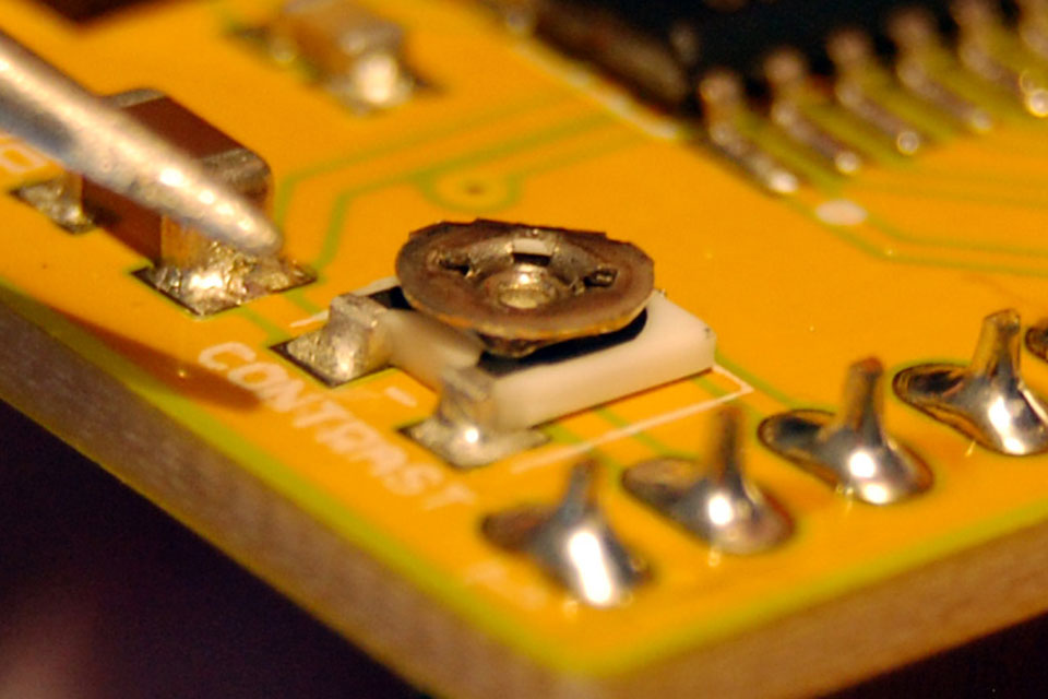 There is a trimpot on the LCD backpack to adjust the contrast of your display. If you look at it from the side, you can actually see the taper. This is the position for maximum contrast. If your display is blank, it is likely you have set the contrast to low.